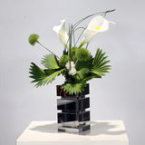 Modern Sculptural Calla Lily & Green Palm Arrangement in Crystal Vase