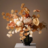 Opalfloral Autumn-Inspired Dried Floral Arrangement with Protea, Eucalyptus & Anthurium in Dark Glass Vase